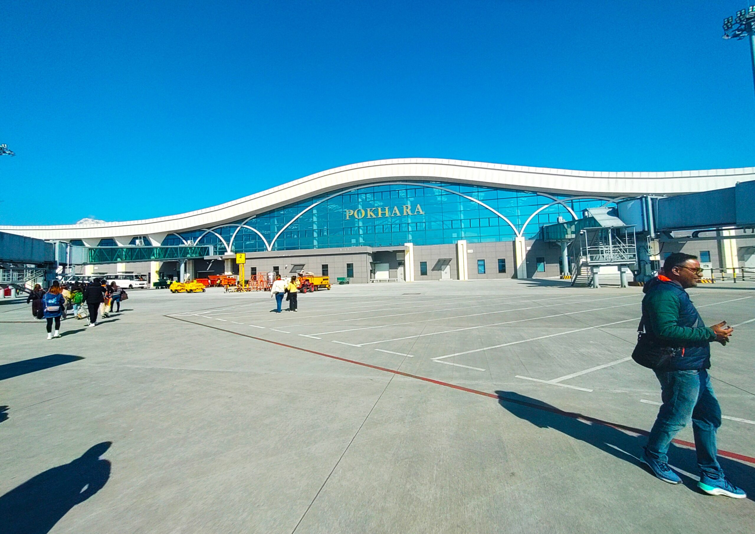"Pokhara Airport, a key hub for heli-tourism, offering stunning views of the surrounding mountains.