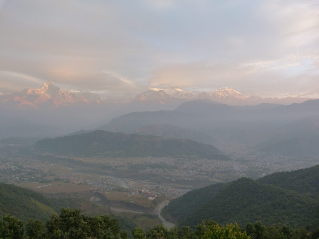 The breathtaking view of Machapuchhare and the Annapurna mountain range from Sarangkot, Nepal. Known for its iconic, fish-tail-shaped peak, Machapuchhare stands tall against the backdrop of the majestic Annapurnas, offering one of the most spectacular vistas in the region.