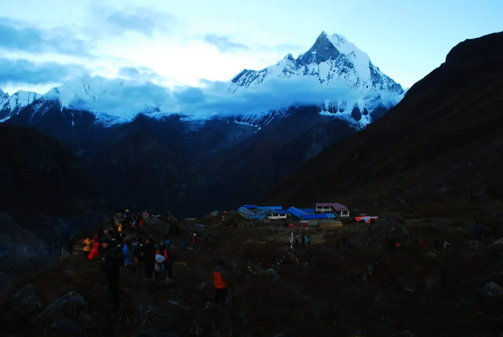 An awe-inspiring shot of Machapuchare Mountain showcasing its sharp peaks and snow-capped summit against the clear sky.
