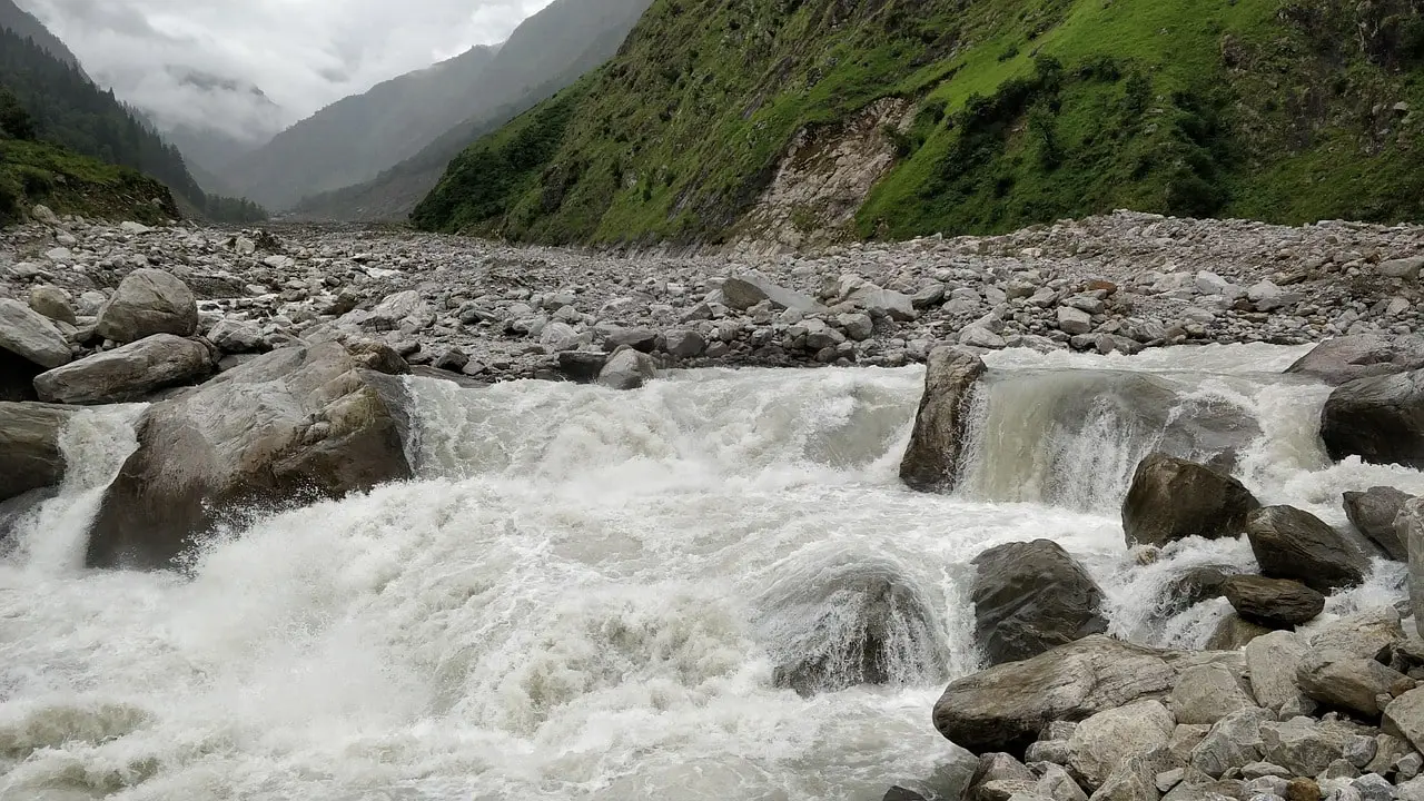 Kali Gandaki River roaring through the deep valleys of the Annapurna region surrounded by towering cliffs and rugged landscapes.